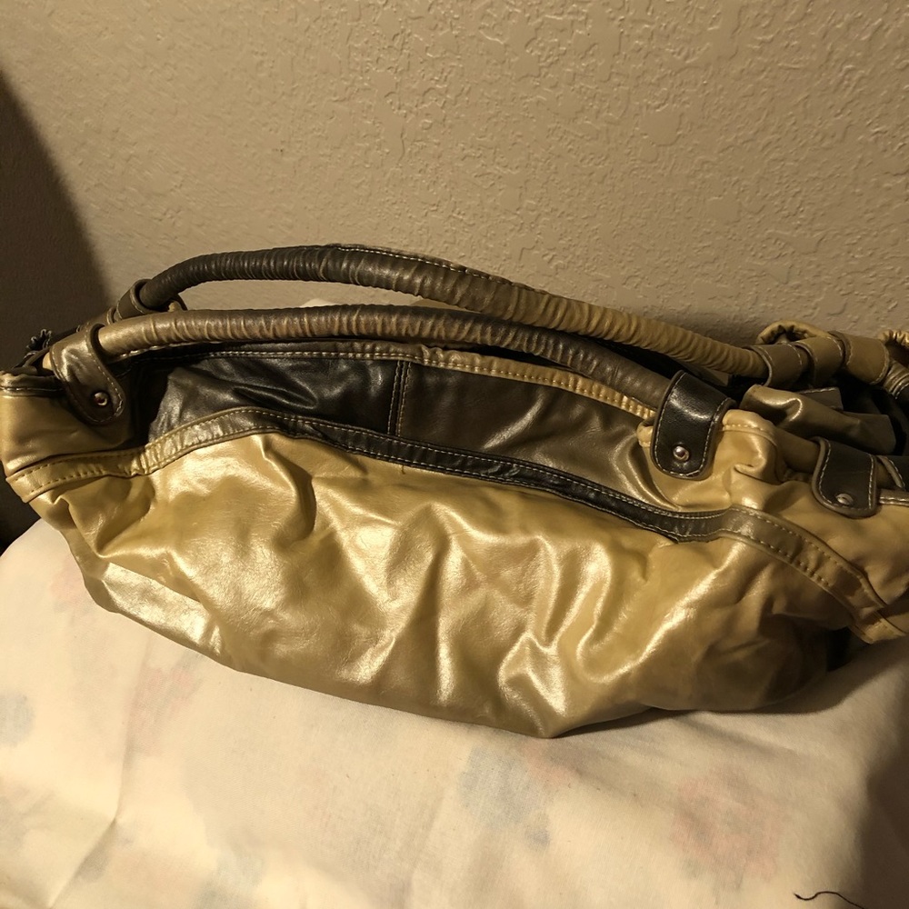 Woman’s purse brown and gold. Unique style.